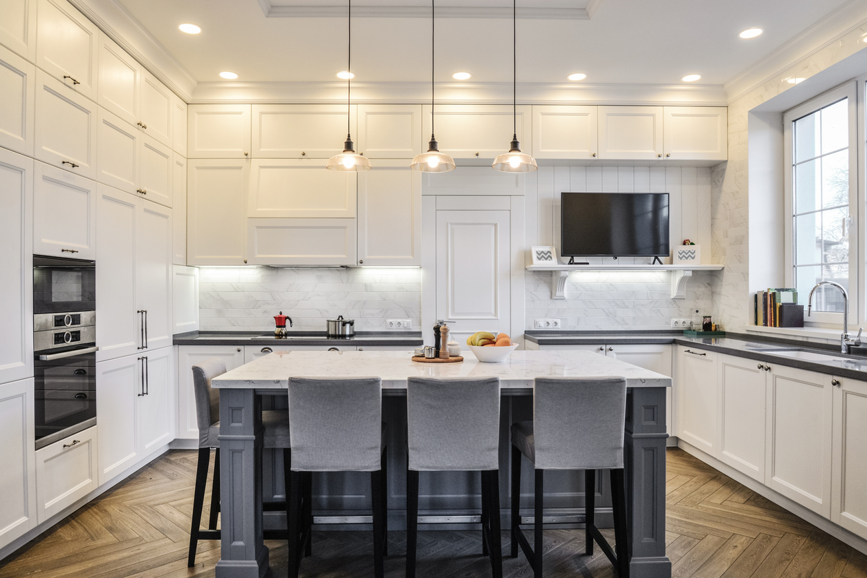 Kitchen interior in new luxury home in scandinavian style with recessed lighting